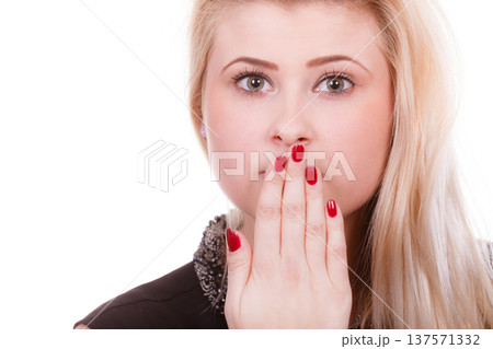 Shocked woman covering mouth with hands Shocked woman covering mouth with hands 137571332