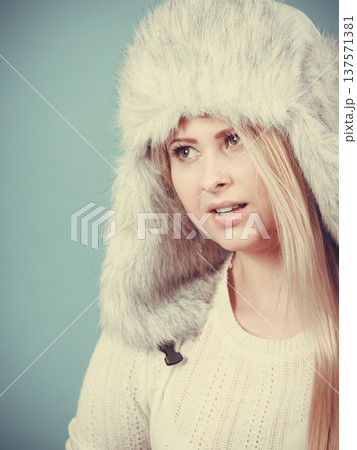 Blonde woman in winter furry hat Blonde woman in winter furry hat 137571381