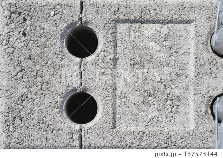 Concrete Block with Circular Holes and Imprint 137573144