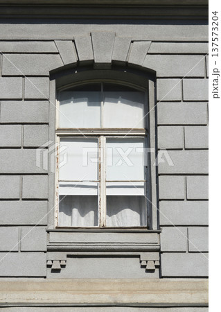 Old Window on Classical Stone Facade 137573204