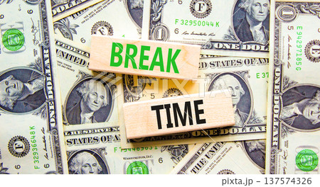 Break time symbol. Concept word Break time on beautiful wooden blocks. Dollar bills. Beautiful dollar bills background. Business break time concept. Copy space. 137574326
