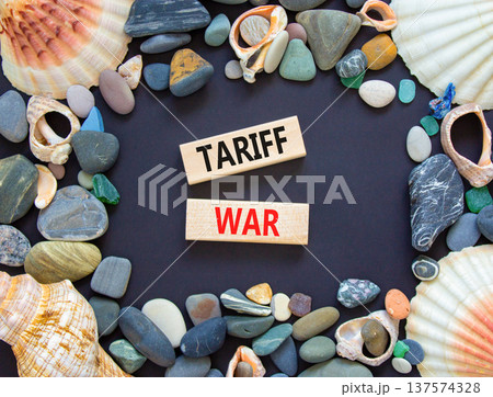 Trade tariff war symbol. Concept word Tariff war on beautiful wooden blocks. Beautiful black paper background. Beautiful sea stones and sea shells. Business trade tariff wars concept. Copy space. Trade tariff war symbol. Concept word Tariff war on beautiful wooden blocks. Beautiful black paper background. Beautiful sea stones and sea shells. Business trade tariff wars concept. Copy space. 137574328