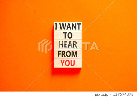 I want to hear from you symbol. Concept words I want to hear from you on beautiful wooden blocks. Beautiful orange paper background. Business support I want to hear from you concept. Copy space. 137574379