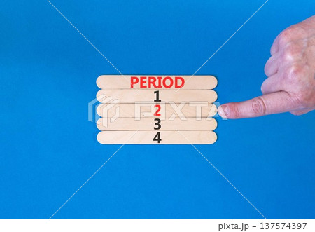 Time to period 2 symbol. Concept word Period 1 2 3 4 on beautiful wooden sticks. Businessman's hand. Beautiful blue background. Business planning and time to period 2 concept. Copy space. 137574397