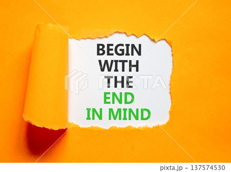 Begin with the end in mind symbol. Concept words Begin with the end in mind on beautiful white paper. Beautiful orange paper background. Business begin with the end in mind concept. Copy space. Begin with the end in mind symbol. Concept words Begin with the end in mind on beautiful white paper. Beautiful orange paper background. Business begin with the end in mind concept. Copy space. 137574530