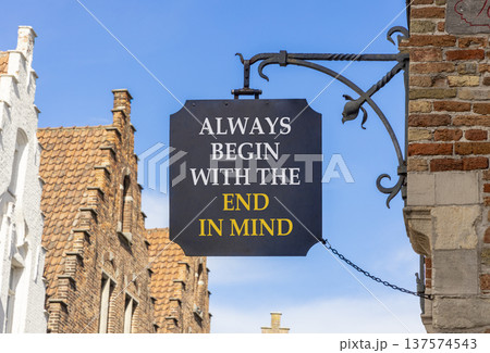 Begin with the end in mind symbol. Concept words Always begin with the end in mind on beautiful black road sign. Beautiful blue sky background. Business begin with the end in mind concept. Copy space. Begin with the end in mind symbol. Concept words Always begin with the end in mind on beautiful black road sign. Beautiful blue sky background. Business begin with the end in mind concept. Copy space. 137574543