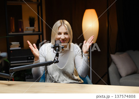 Radio host speaking with energy during a live podcast recording Radio host speaking with energy during a live podcast recording 137574808