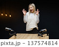 Podcaster gesturing ok sign during recording podcast 137574814