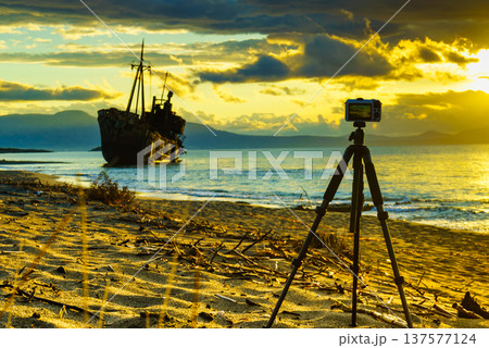 Camera on tripod and shipwreck Camera on tripod and shipwreck 137577124