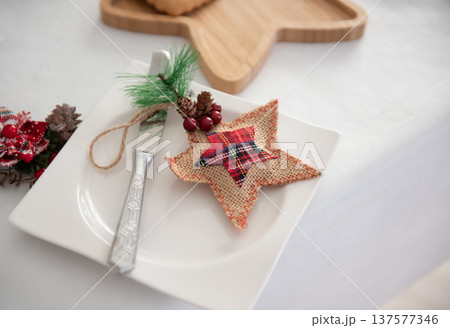 beautiful New Year's serving of the festive table with plates beautiful New Year's serving of the festive table with plates 137577346