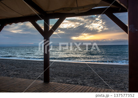 gazebo by the sea, bathed in the sun at dawn. High quality photos. gazebo by the sea, bathed in the sun at dawn. High quality photos. 137577352