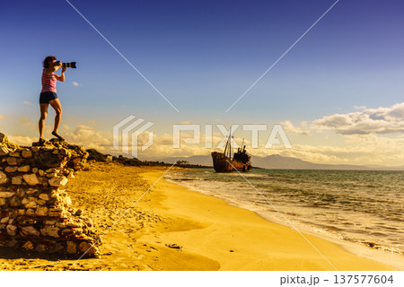 Tourist take photo on beach sea shore 137577604