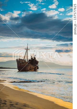 Rusty broken shipwreck on sea shore 137577625