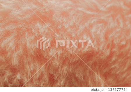 Soft pink plush fabric background with long fuzzy fibers, macro shot of delicate textile surface for romantic design or beauty backdrop 137577734