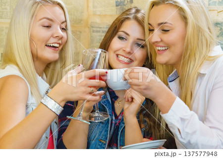 Girls with alcohol glass in pub club Girls with alcohol glass in pub club 137577948