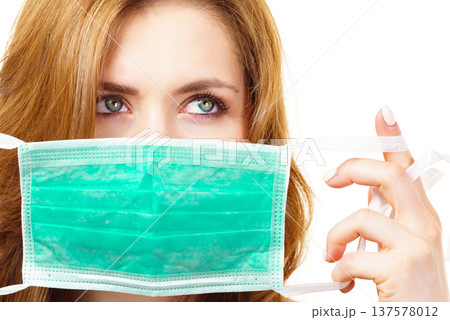Female using protective face mask. 137578012