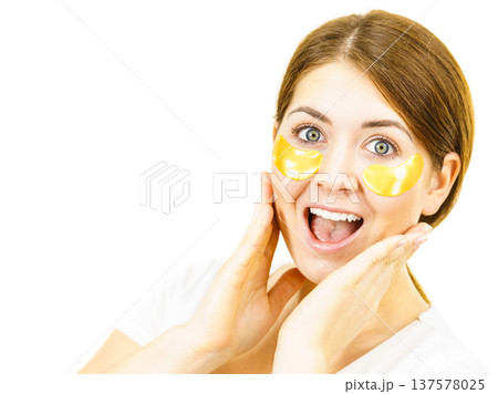 Woman with gold patches under eyes Woman with gold patches under eyes 137578025