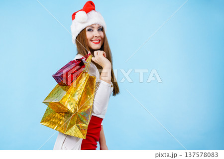 Happy Christmas woman with paper gift bags Happy Christmas woman with paper gift bags 137578083