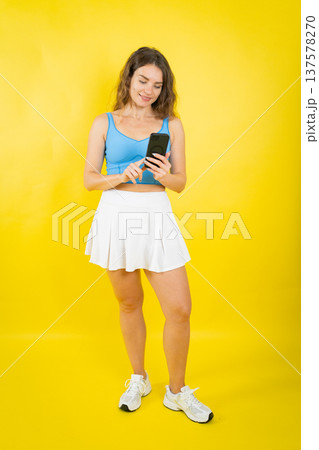 Woman smiling while using smartphone apps 137578270