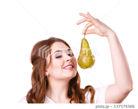 Woman holding pear fruit, isolated. Healthy diet. Woman holding pear fruit, isolated. Healthy diet. 137578366
