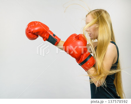 Woman in red gloves boxing Woman in red gloves boxing 137578592