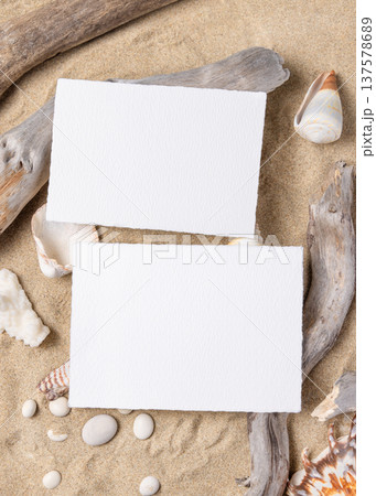 Wedding horizontal card mockup set on sand with seashells and driftwood, beach event design Wedding horizontal card mockup set on sand with seashells and driftwood, beach event design 137578689
