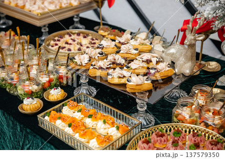 Catering buffet table with holiday appetizers and snacks Catering buffet table with holiday appetizers and snacks 137579350
