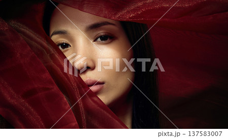 Beauty portrait of Korean woman partially covered with translucent red fabric, cinematic lighting Beauty portrait of Korean woman partially covered with translucent red fabric, cinematic lighting 137583007