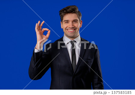 Positive Mature Businessman With Ok, Okay Hand Sign Gesture. Happy Man On Blue 137583185
