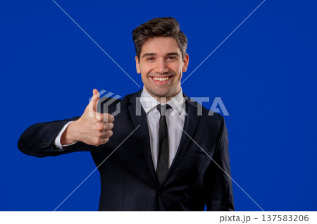Businessman With Hand Sign Like,Thumbs Up Gesture On Blue. Happy Ceo Leader Man Businessman With Hand Sign Like,Thumbs Up Gesture On Blue. Happy Ceo Leader Man 137583206
