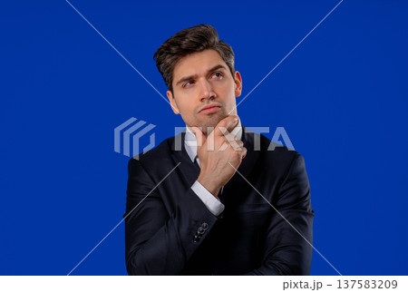 Thinking Businessman Looking Up, Searching Opportunity On Blue Background 137583209
