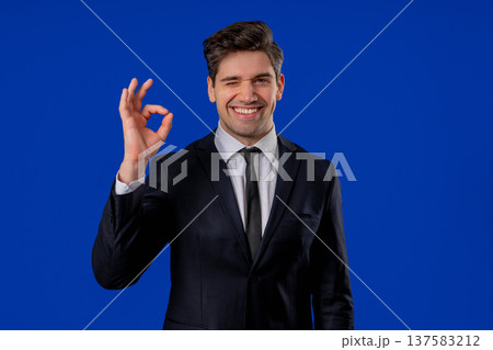 Positive Mature Businessman With Ok, Okay Hand Sign Gesture. Happy Man On Blue 137583212