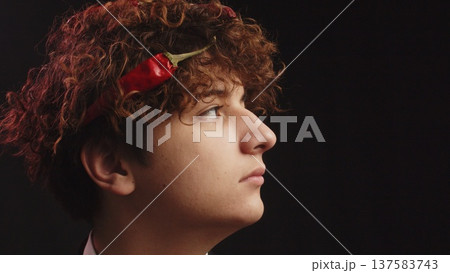 A red hot pepper in his hair. A red hot pepper in his hair. 137583743