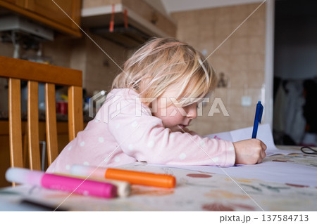 Little 4 Year Old Girl Learning to Write Letters in the Kitchen Little 4 Year Old Girl Learning to Write Letters in the Kitchen 137584713