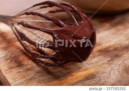 metal whisk, close-up with chocolate dough , baking, structure and consistency, homemade, top view, no people, 137585202