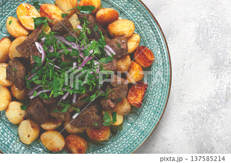 kuyrdak, roast offal with potatoes and fresh herbs, homemade in Kazakh, no people, kuyrdak, roast offal with potatoes and fresh herbs, homemade in Kazakh, no people, 137585214