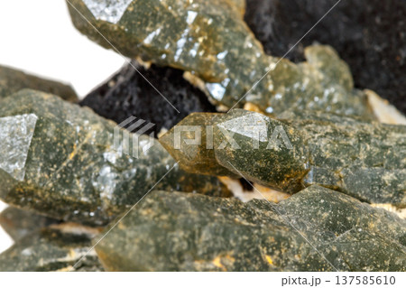 Macro mineral stone Quartz Hedenbergite Prase on ilvite on a white background Macro mineral stone Quartz Hedenbergite Prase on ilvite on a white background 137585610