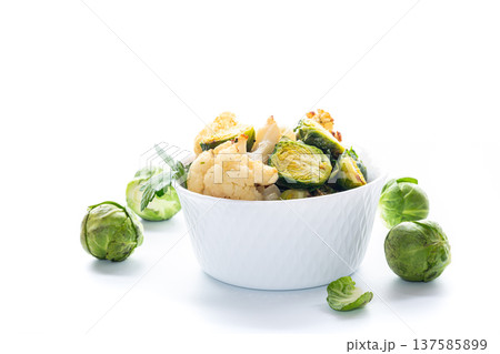 Warm salad with Brussels sprouts on a white background 137585899