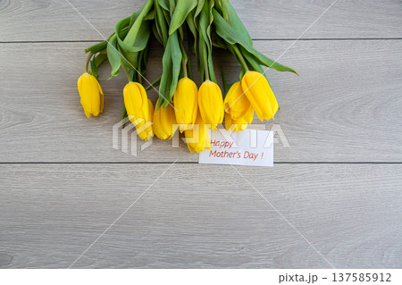 elegant yellow tulips bouquet with greeting card spring holiday 137585912