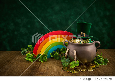 St. Patrick's day pot of gold with shamrocks and leprechaun hat St. Patrick's day pot of gold with shamrocks and leprechaun hat 137586076