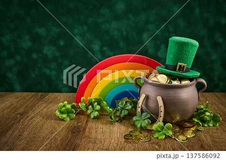 St. Patrick's day celebration with pot of gold and rainbow St. Patrick's day celebration with pot of gold and rainbow 137586092