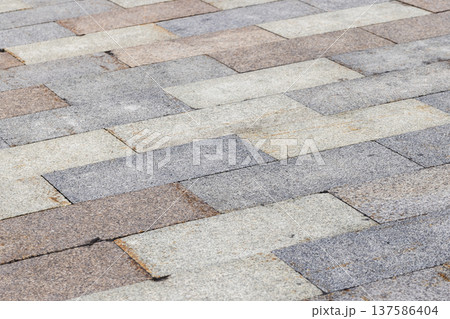Street pavement made of granite tiles Street pavement made of granite tiles 137586404