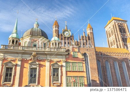 St. Mary's Church in Gdansk, a city on the Baltic coast of northern Poland, Europe. Cityscape of old town Gdansk Poland, featuring historic architecture, domes, towers, and a clock tower. St. Mary's Church in Gdansk, a city on the Baltic coast of northern Poland, Europe. Cityscape of old town Gdansk Poland, featuring historic architecture, domes, towers, and a clock tower. 137586471
