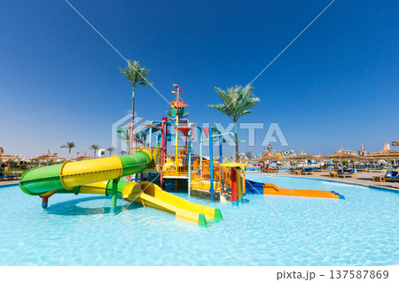 swimming pool with coconut tree and white umbrella swimming pool with coconut tree and white umbrella 137587869