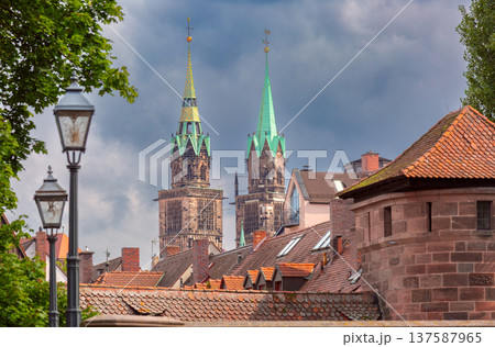 View of Saint Sebald Church towers above old rooftops in Nuremberg Germany View of Saint Sebald Church towers above old rooftops in Nuremberg Germany 137587965