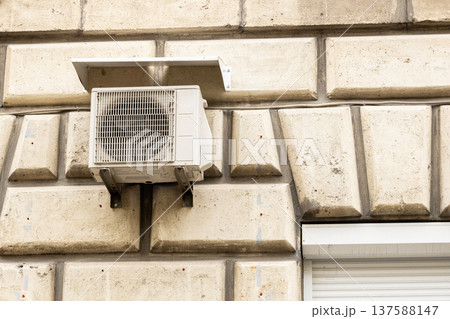 air conditioning on facade of building, air cooling in hot weather.  137588147