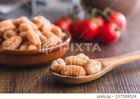 Rustic tomato Gnocchi in spoon Ready to Cook Comforting Italian Pasta Dish Rustic tomato Gnocchi in spoon Ready to Cook Comforting Italian Pasta Dish 137589524