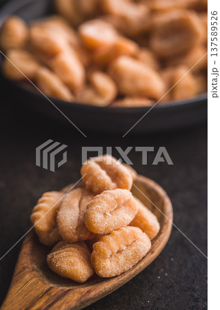 Rustic tomato Gnocchi in spoon Ready to Cook Comforting Italian Pasta Dish Rustic tomato Gnocchi in spoon Ready to Cook Comforting Italian Pasta Dish 137589526