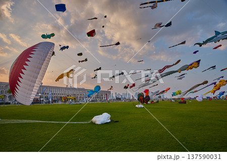 Doha, Qatar - January 20 2026: Qatar Kite Festival 2026 in Old Doha port (Mina District) sunset shot showing spectacular showcase of colorful kites 137590031