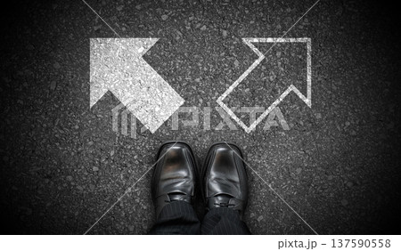 Black business shoes and two chalky arrows on asphalt - choice concept Black business shoes and two chalky arrows on asphalt - choice concept 137590558